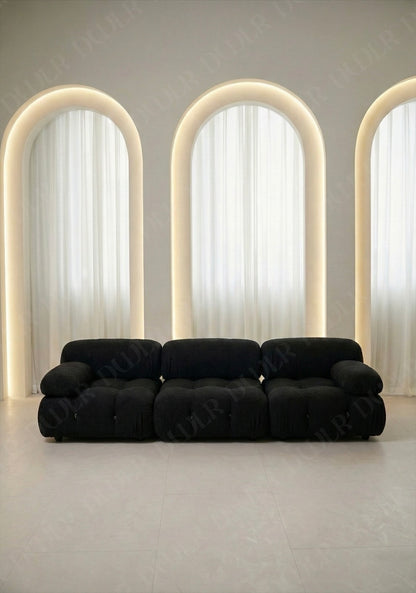 3 seater Cierra modular sofa in black boucle upholstery with plush cushioned seats and modular sectional design