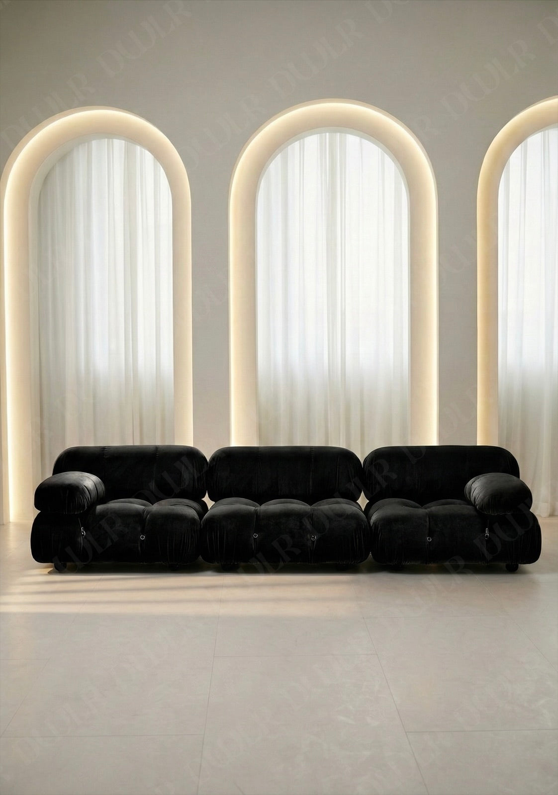 3 seater Cierra modular sofa in black velvet upholstery with plush cushioned seats and modular sectional design. 
