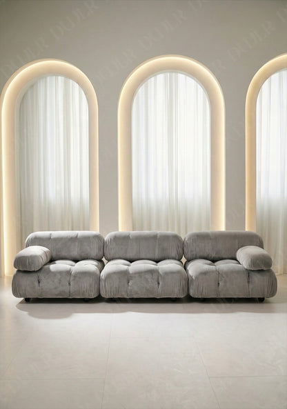 3 seater Cierra modular sofa in light grey velvet upholstery with plush cushioned seats and modular sectional design