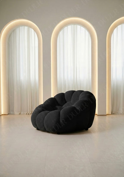 Benna Cloud Chair in black mesh upholstery with plush, rounded cushions
