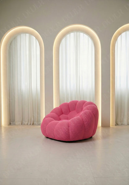 Benna Cloud Chair in pink mesh upholstery with plush, rounded cushions
