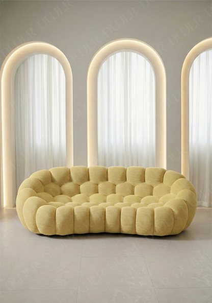 Benna Cloud Sofa in yellow mesh upholstery with rounded, cushioned silhouette