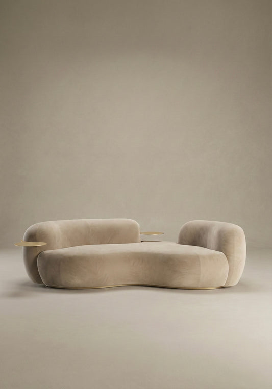 Bera sofa in beige velvet upholstery with integrated side table and curved low profile design