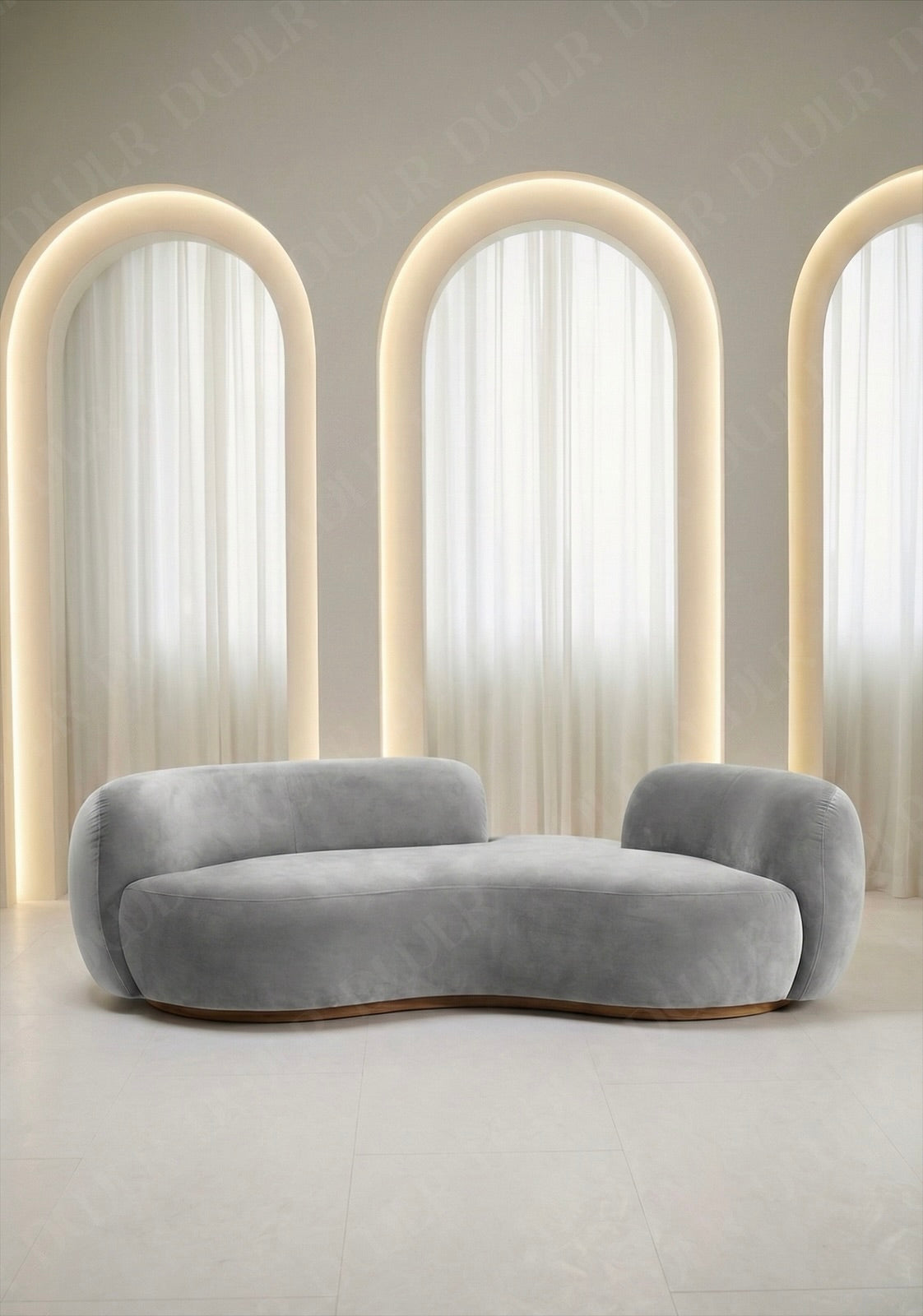 Bera sofa in light grey velvet upholstery with curved silhouette and low profile design, without integrated side table