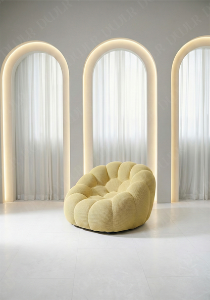 Benna Cloud Chair in yellow mesh upholstery with plush, rounded cushions