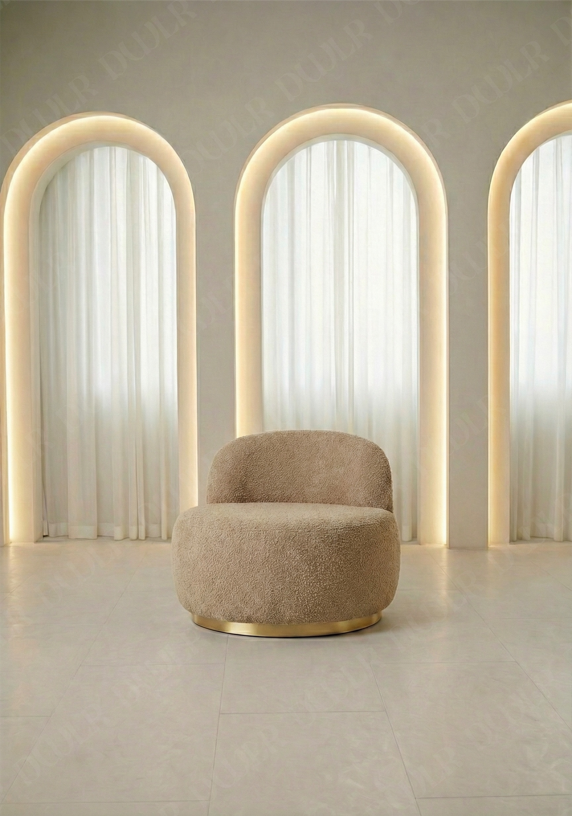 Beige armchair in a room with three arch-shaped light fixtures.