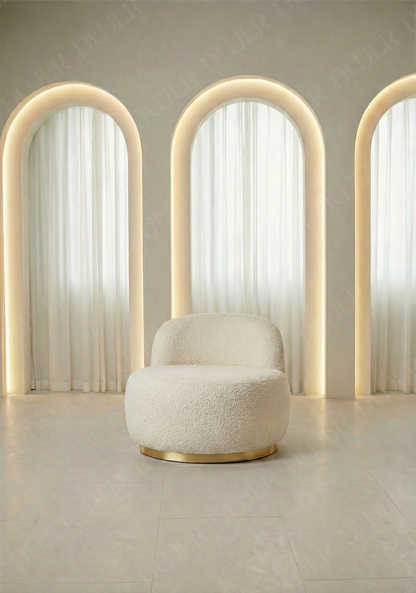 Modern chair with a textured seat and gold base in front of three illuminated arches.