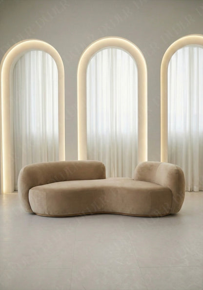 Bera sofa in beige velvet upholstery with curved silhouette and low profile design, without integrated side table