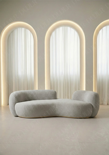 Bera sofa in light grey boucle upholstery with curved silhouette and low profile design, without integrated side table