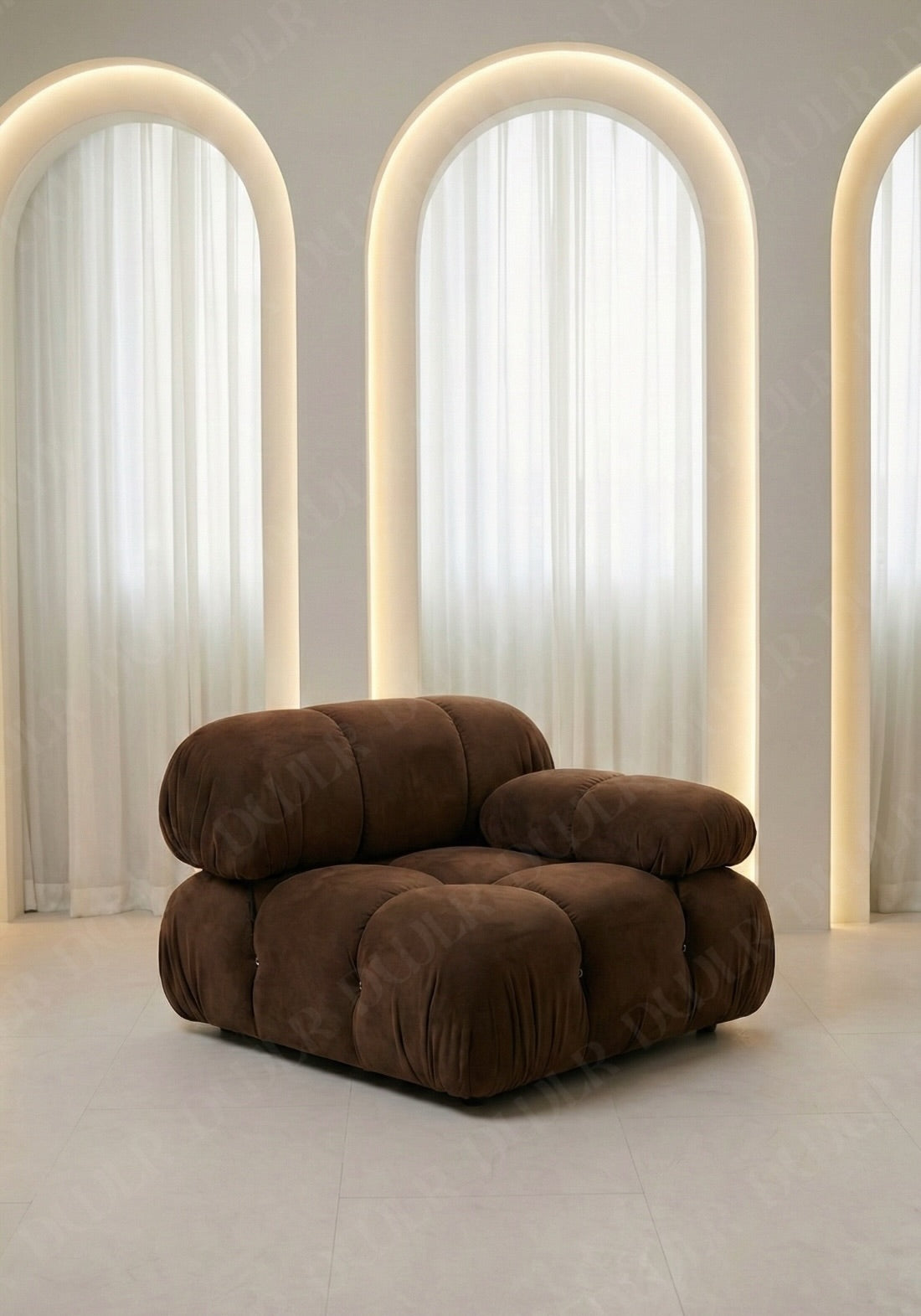 Cierra modular seat with backrest and low armrest in brown suede upholstery designed for flexible seating layouts