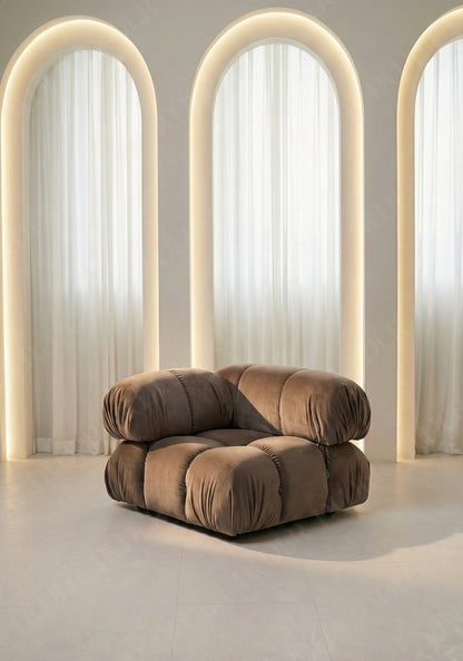 Cierra modular seat with backrest and high armrest in taupe velvet upholstery designed for flexible seating layouts