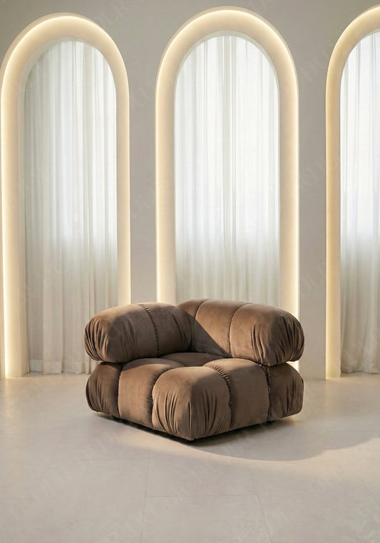 Cierra modular seat with backrest and high armrest in taupe velvet upholstery designed for flexible seating layouts