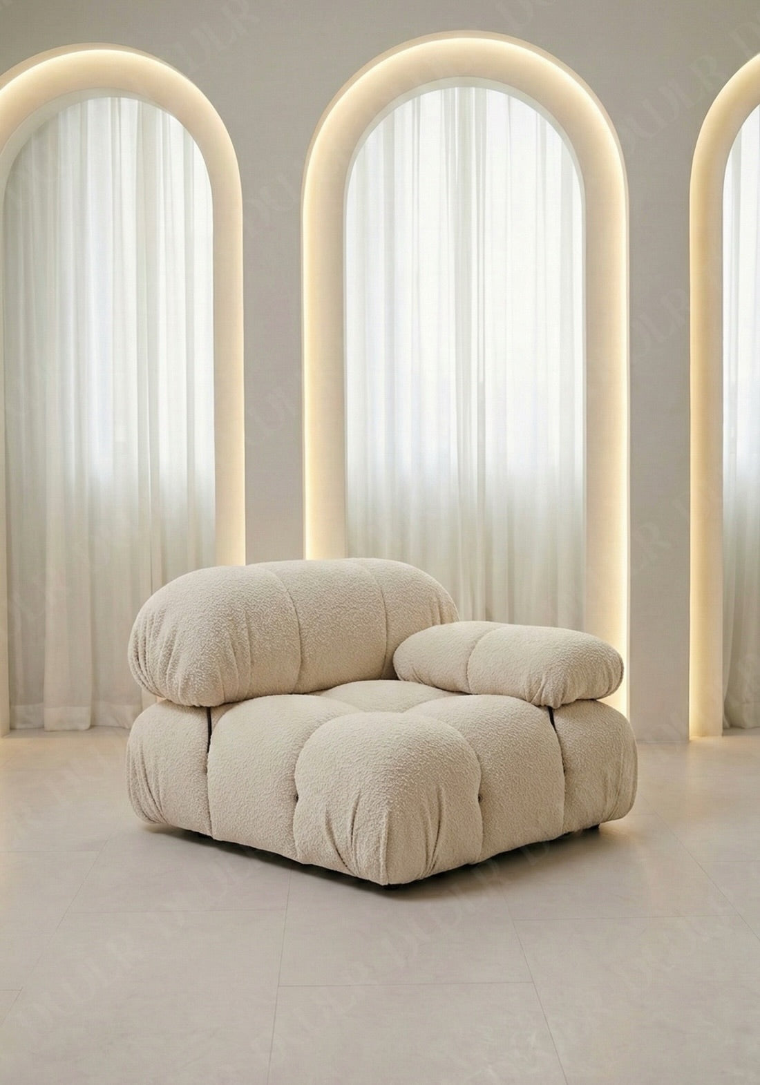 Cierra modular seat with backrest and low armrest in off white boucle upholstery designed for flexible seating layouts