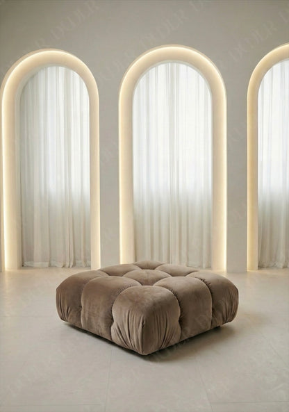 Cierra modular ottoman upholstered in taupe velvet fabric designed to be used as footrest or seating extension