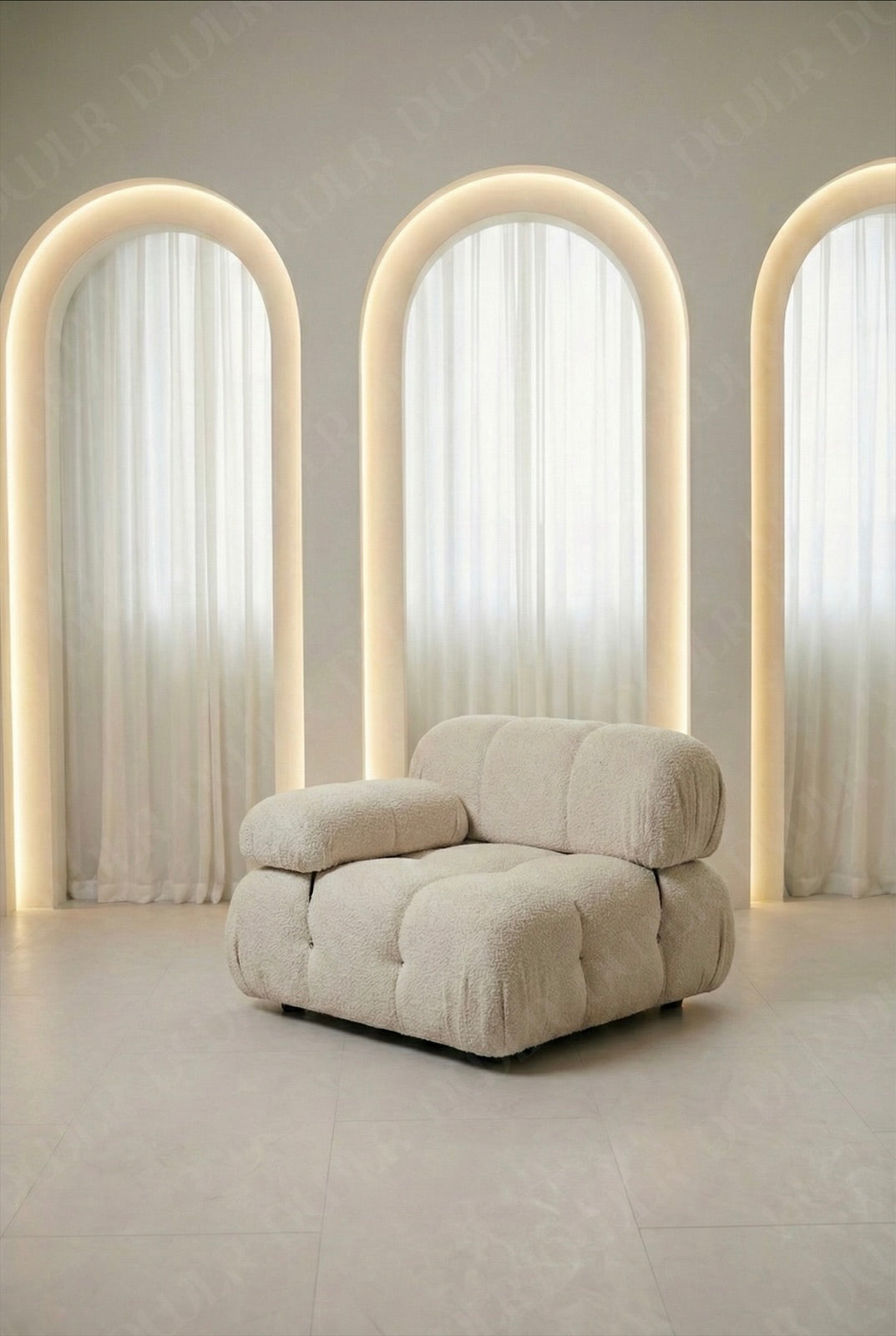 Cierra modular middle seat with backrest and armrest in off white boucle upholstery designed for flexible seating layouts