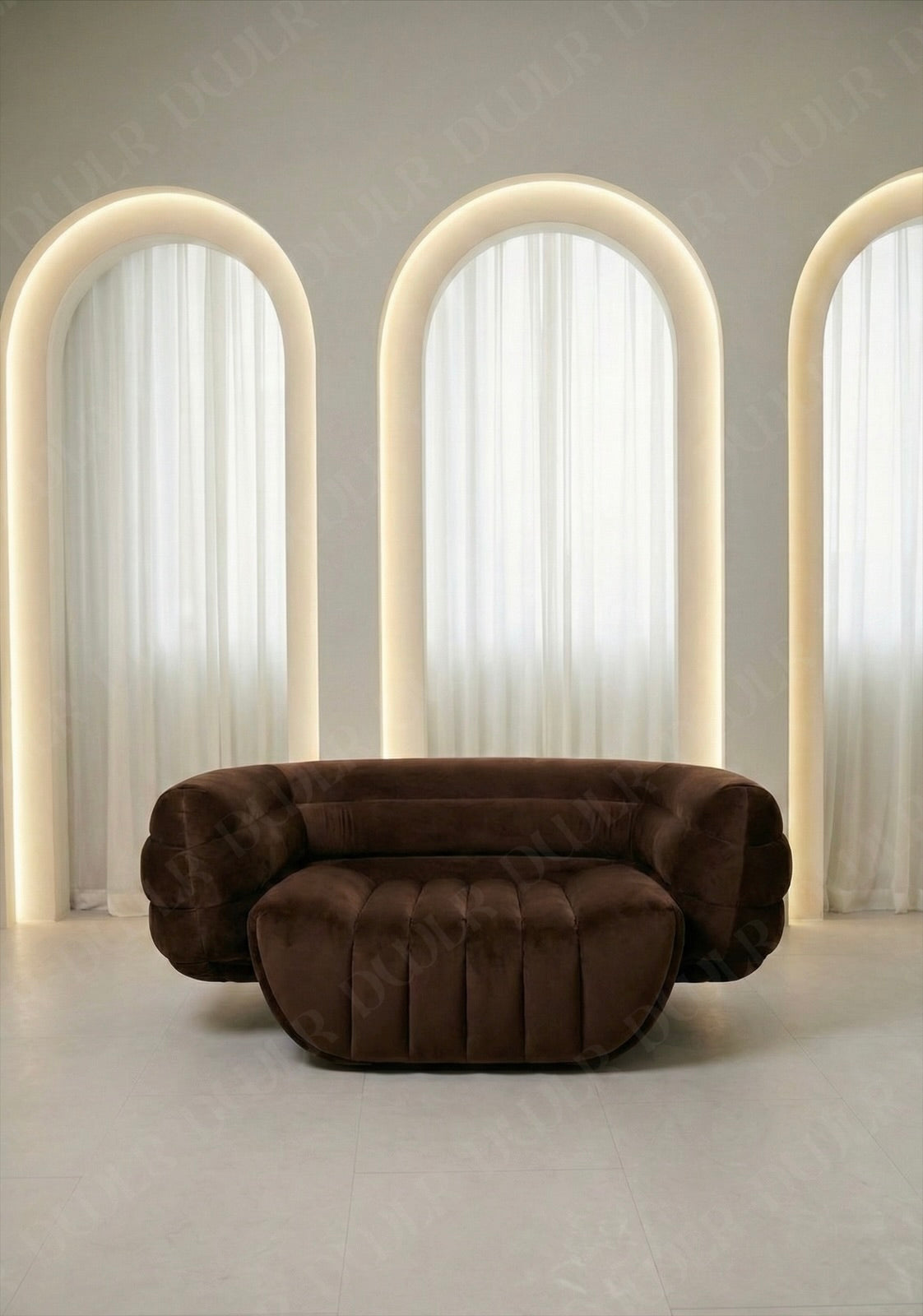 Brown sofa in a room with arches and soft lighting