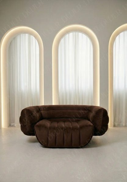 Brown sofa in a room with arches and soft lighting