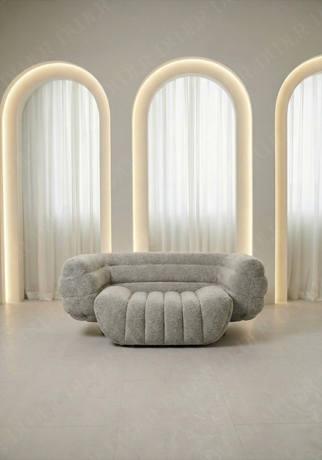 Modern gray sofa in a room with arches and soft lighting