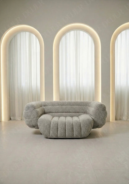 Modern gray sofa in a room with arches and soft lighting