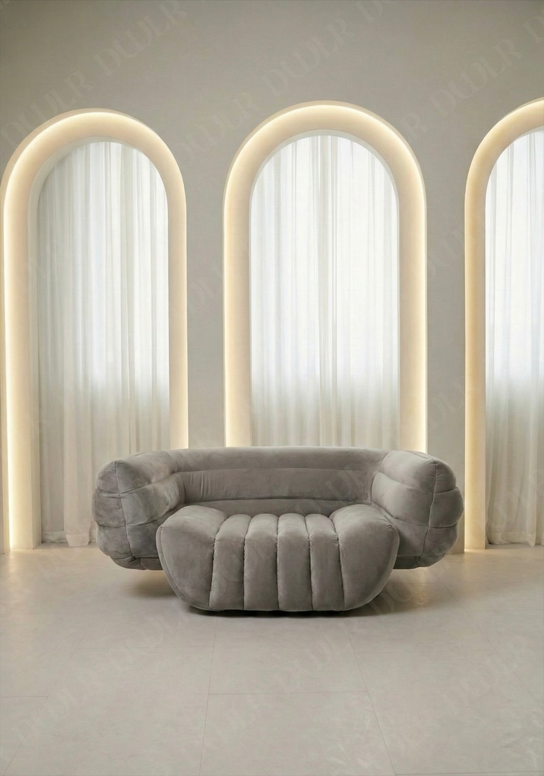 Gray sofa in a room with arches and soft lighting