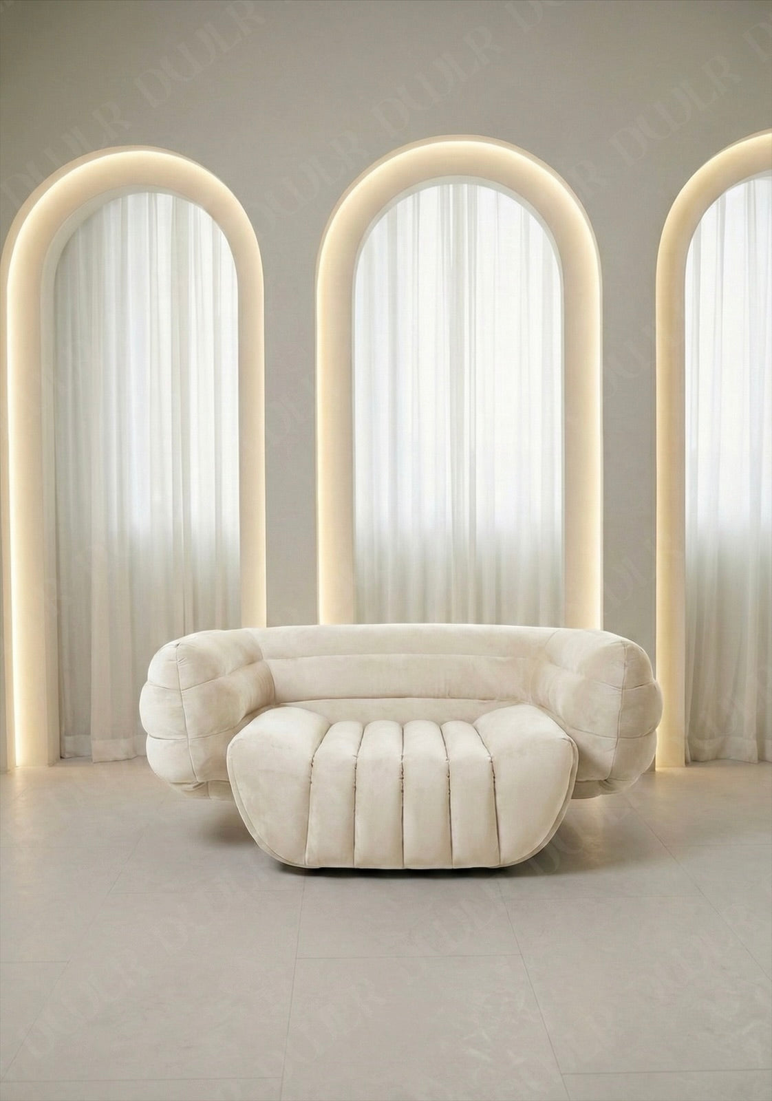 Modern white sofa in a room with arch-shaped light fixtures.