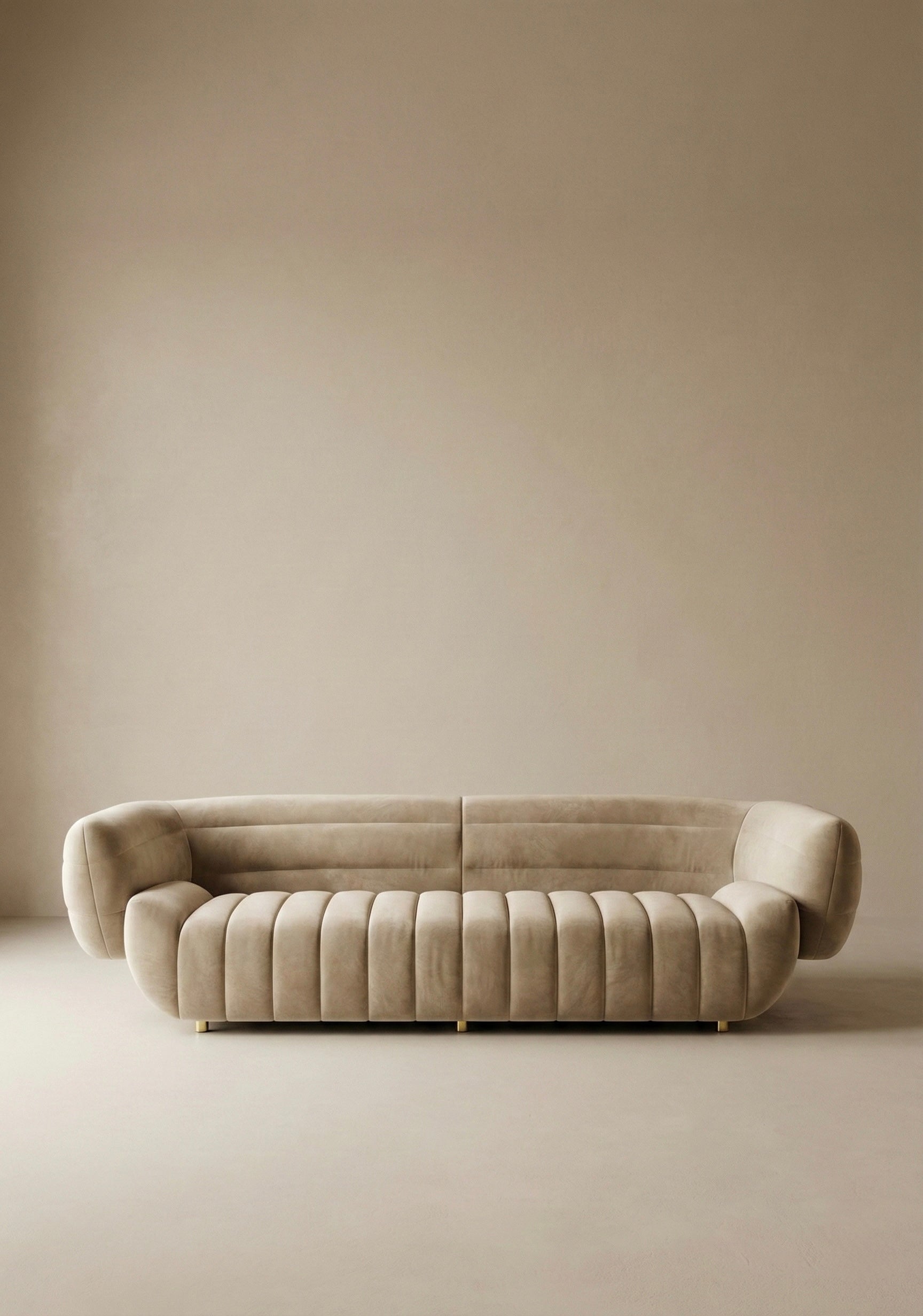 Solara sofa in beige velvet upholstery with curved silhouette and channel tufted seat in modern living room