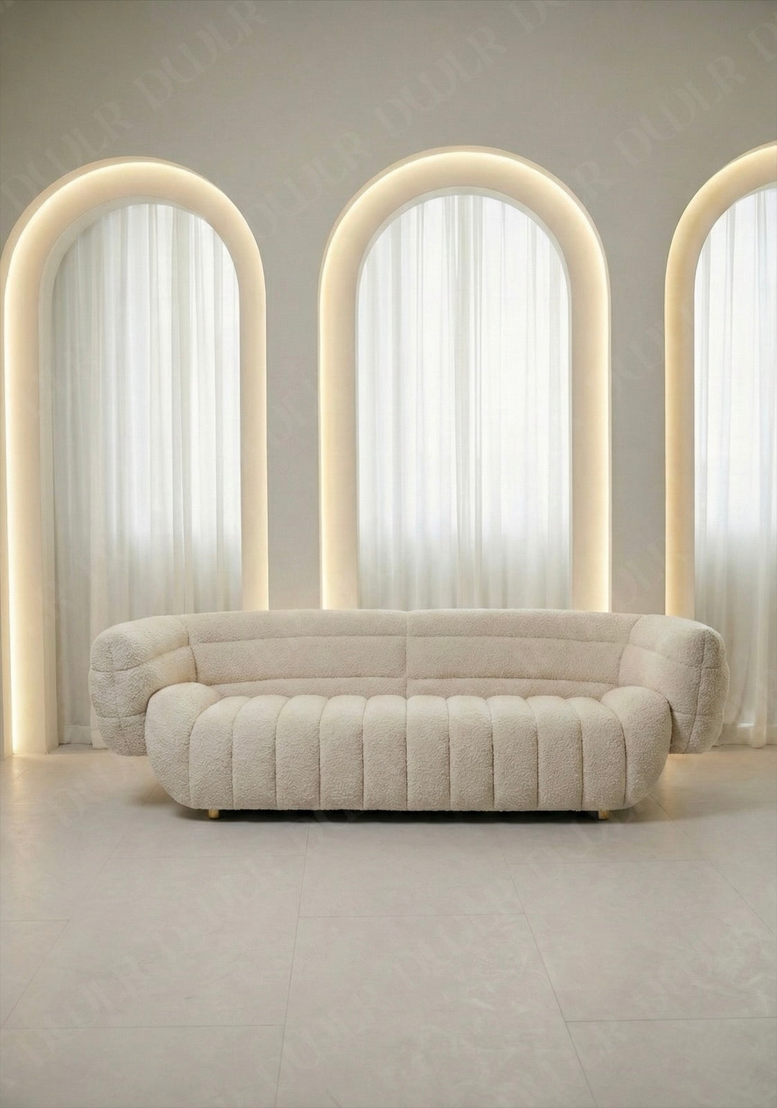 Solara sofa in off white taupe boucle upholstery with curved silhouette and channel tufted seat in modern living room.